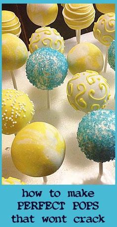 cake pops with yellow and blue frosting sitting on top of a white platter