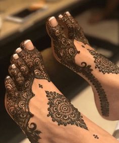 the feet are decorated with henna and flowers