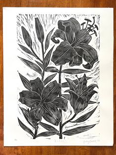 a black and white drawing of some flowers