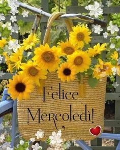 a basket with sunflowers hanging from it