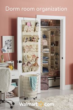 an organized closet with clothes hanging on the door and shoes in baskets next to it