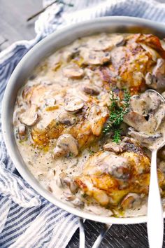 a white bowl filled with chicken and mushroom soup