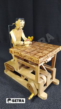 a wooden table with a statue sitting on top of it