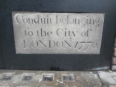 a plaque that reads condui belonging to the city of london 776 on it