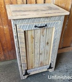 an old wooden cabinet sitting next to a wall