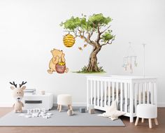 winnie the pooh wall decals in a child's room with a tree and honey