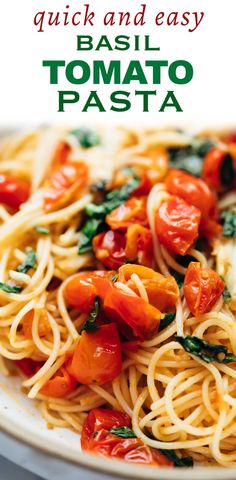 a white plate topped with pasta and tomatoes