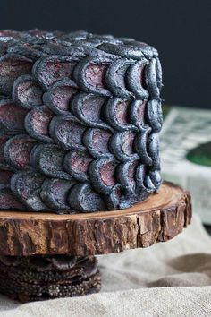 a close up of a cake on a wooden plate