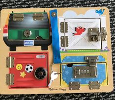 a wooden toy with magnets attached to it's doors and keys in the shape of trains