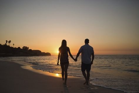 couple holding hands while walking on beach Couples Walking Together, Couple Holding Hands While Walking, Couple Walking Holding Hands, Holding Hands On The Beach, Happy Friendship Day Picture, Couple Walking On Beach, Holding Hands While Walking, Holding Hands Images, Couple Walking Together