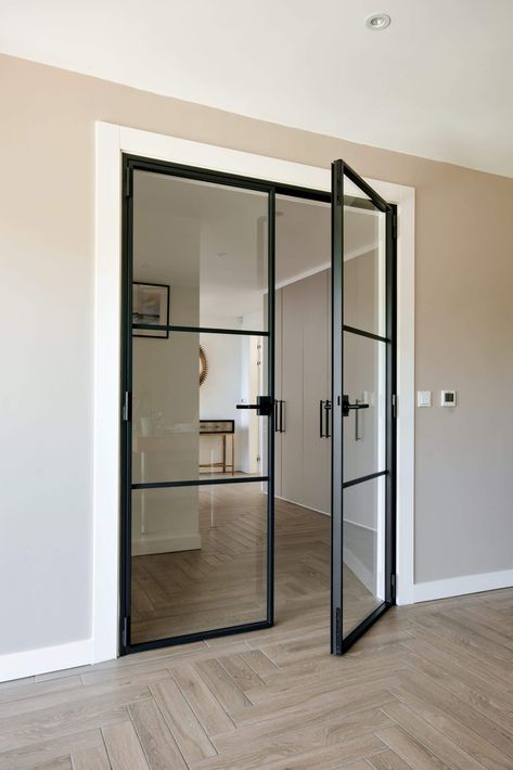 Black Frame Double Doors, Hallway With Glass Doors, Black Crittall Doors, Double Crittal Doors Internal, Black Steel Door Interior, Modern Double Doors Interior, Black Steel Glass Doors, Black Window Door Interior, Glass Door In Living Room