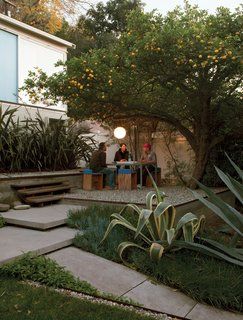 Surrounded by flax, agaves, and a prolific lemon tree, the gravel terrace out front makes an inviting place to eat, work, or party. Molina and Turin fashioned the table from repurposed glass and Unistrut tube steel and the humble chairs from plywood wrapped in sheets of blue foam. Outdoor Rooms, Landscape Architecture, Echo Chamber, Citrus Trees, Outdoor Design, Modern Garden, Dream Garden, Backyard Garden, Land Scape