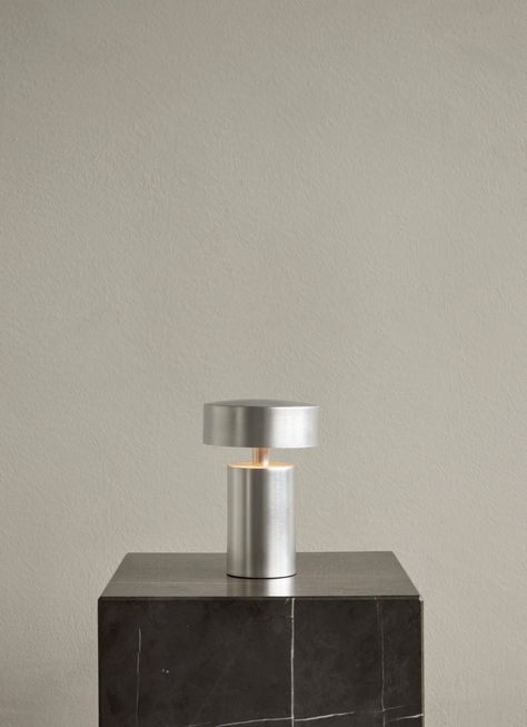 Designed by Danish design team Norm Architects for Menu, the Column LED Table lamp's design was inspired by the bollards on board ships. The Column Table lamp produces a warm, comfortable light that makes any room more inviting, It's classic design and bronze anodized aluminum color suits any style interior. Menu's Column Table Lamp is cordless and rechargeable via a USB charger. The LED light bulb produces soft, diffused, comfortable light with three settings. This allows unrestricted placement Column Table, Norm Architects, Portable Table, Portable Lamps, Led Table, Led Table Lamp, Brushed Aluminum, Burke Decor, Room Lights