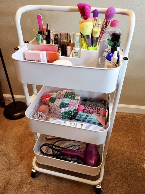 A three-tier storage cart that can hold anything that needs sorting, from beauty products to craft supplies. Trolley Cart Organization, Bathroom Rolling Cart Storage, Organisation, Beauty Storage Bedroom, 3 Tier Trolley Storage Ideas, Vanity Cart Ideas, Beauty Room Storage, Makeup Cart Organizing, Beauty Supplies Organization