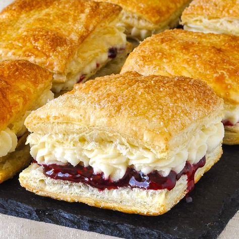 Homemade Flakies with raspberry compote & vanilla cream. A nostalgic tribute to the Vachon Flakie, one of my very favourite snack cake treats as a kid.#canada #canadianfood #puffpastry #puffpastryrecipes #easydessert Cakes With Pastry Cream Filling, Cake And Pastry Flour Recipes, Flaky Pastry Recipe Desserts, German Pastry Recipes, Canadian Recipes Traditional, Prize Winning Desserts, Newfoundland Desserts, Flaky Desserts, Homemade Flakies