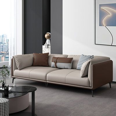 With a simple appearance composed of microfiber leather in coffee and khaki, the rectangle sofa characterizes a large space. A solid wood frame and high-density sponge make it superior soft and comfortable, sturdy and durable. Furthermore, the concise and light luxury design of the sofa is perfect to enhance your room decor, set it in your living room, bedroom, game room or any other area is the best. | Wrought Studio Bezawit Nordic Luxury Simple Loveseat Faux Leather Sofa black/Brown 70.9 x 37. Light Cream Sofa, Leather Sofa Drawing Room, Leather Sofa Cream, Gray Leather Couch Living Room, Cream Leather Sofa Living Room, Office Mandir, Coffee Factory, Leather Sofa Living, Timeless Sofa