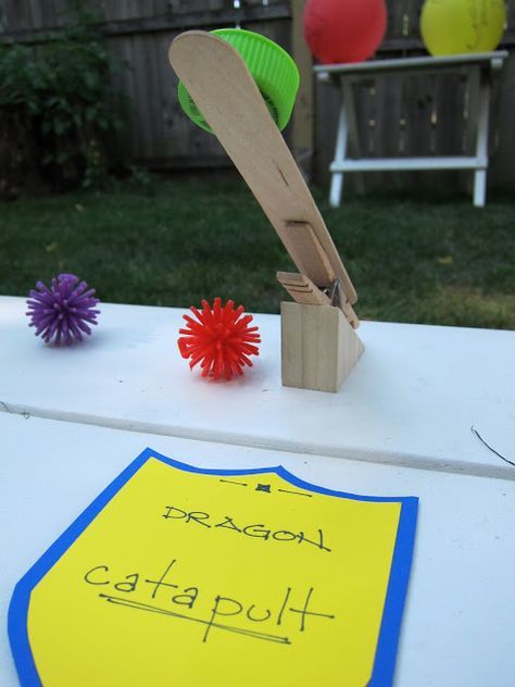 Medieval Book fair-Dragon catapult game with clothespins and foam balls Knight Party Ideas, Knights Party, Knight Birthday, Knight Birthday Party, Hanging Balloons, Castle Party, Medieval Games, Dragon Birthday Parties, Knight Party