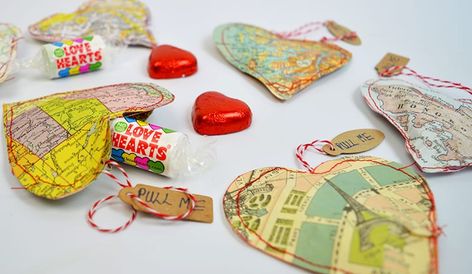 13 sweet, upcycled Valentine's Day DIY projects. See more Valentine craft ideas on DuctTapeAndDenim.com #upcycled #valentineDIY #valentinesday #valentinesdaycrafts #ducttapeanddenim Upcycling, Map Wrapping Paper, Valentines Treat Bags, Road Maps, Map Crafts, Heart Map, Deco Mesh Christmas Wreaths, Heart Shaped Cookies, Heart Crafts