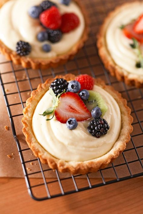 Planning a tea party or fancy brunch? Make sure you include one (or more) of these delicious tart recipes on the menu. While fruit tart recipes featuring apples, pears, or citrus might be a go-to, we've got a slew of fancy tart ideas made with chocolate, berries, and even savory ingredients to consider. #recipeideas #recipes #dessert #dessertrecipes #bhg Desserts That Aren’t Too Sweet, Fruit Puff Pastry Dessert, Individual Desserts For Parties, Summer Pastries, Tart Desserts, Dessert Tarts, Fruit Deserts, Fruit And Cream, Mini Tart Recipes