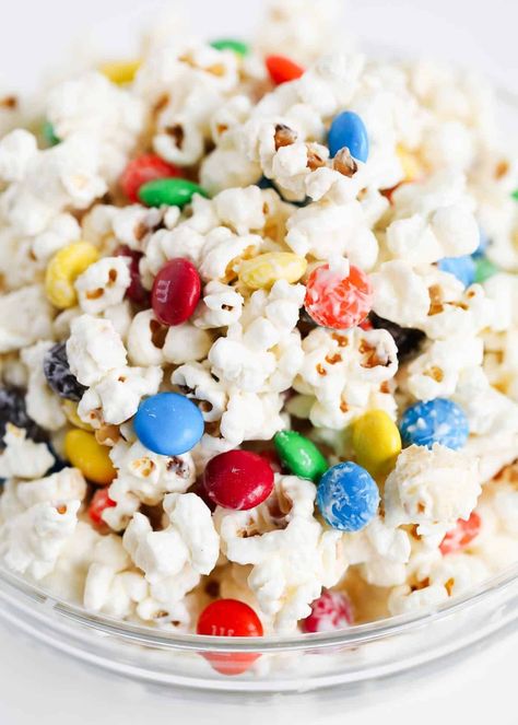 M&M popcorn is the best kind of sweet treat! It's easy, fast, crispy, crunchy, and so addicting! It makes the best party snack, last-minute dessert, Super Bowl Popcorn, Popcorn M&m Snack, M&m Popcorn Recipes, Popcorn With M&m, M&m Popcorn, Popcorn And M&ms, Desert Popcorn, Best Party Snacks, American Advertising