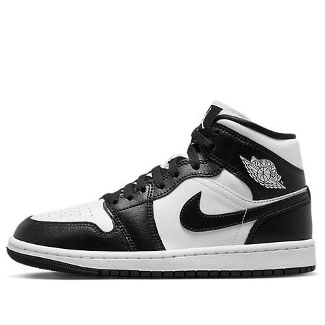 The Air Jordan 1 Mid 'Panda' is a stylish and comfortable sneaker for adults. The classic silhouette has been enhanced with a supportive upper and a slip-resistant outsole. The black and white colorway is perfect for any occasion, from casual days out to a night on the town. The sneaker is inspired by the classic Jordan 1 series, offering a timeless look that will never go out of style. Black And White Jordans, Jordan Mid, Wmns Air Jordan 1, White Jordans, Retro Basketball Shoes, Nike Air Jordan 1 Mid, Kids Jordans, Air Jordan 1 Mid, Jordan 1 Mid