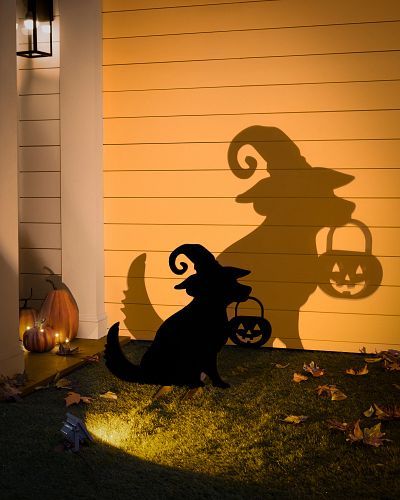 Surprise the neighborhood with spooky scenes featuring familiar and frightful characters. Amplified by an eerie orange glow, these silhouettes make for a perfect porch, lawn, or roof display at Halloween-themed parties. | Outdoor Illuminated Trick-or-Treat Dog Silhouette Halloween Outdoor Scenes, Big Yard Halloween Decorations, Halloween Balcony Ideas, Outdoor Decor Halloween, Halloween Window Silhouettes, Silhouette Decor, Realistic Christmas Trees, Halloween Silhouette, Halloween Lawn