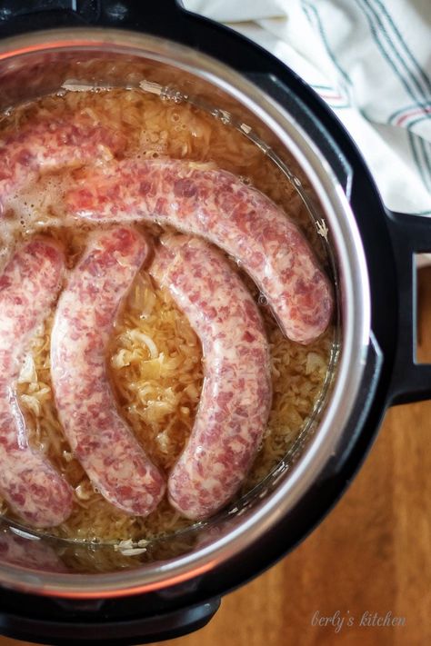 Top-down shot of the brats, in the pressure cooker, just before sealing. Flan, Pressure Cooker Brats, Bratwurst Recipes Instant Pot, Sausage And Sauerkraut Instant Pot, Instant Pot Bratwurst, Brats And Sauerkraut, Beer Brats Recipe, Brats Recipes, Bratwurst Recipes