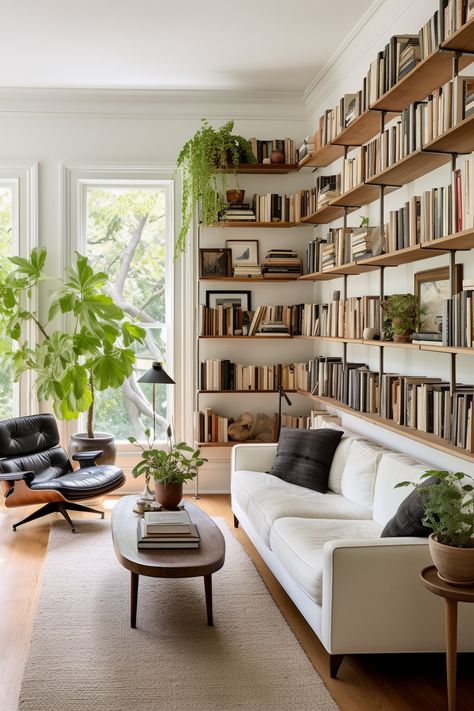 Discover chic shelving units to transform large walls into functional and stylish focal points. Maximize space with these design ideas. #StylishShelves #FunctionalDesign #HomeDecor Colorful Timeless Home, Green Cottage Living Room Ideas, Narrow Walk Through Living Room Layout, Simple Wall Bookshelves, Dividing Space Without Walls, Small Mid Century Modern Living Room Layout, Lounge Bookcase Ideas, Room Divider Open Concept, Low Shelf Living Room