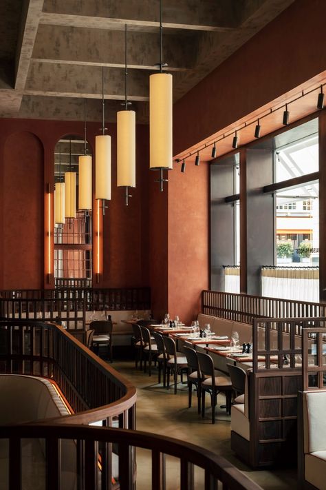 Maison François brasserie takes cues from Ricardo Bofill's architecture Ricardo Bofill, Polished Concrete Flooring, Walnut Timber, Walnut Dining Chairs, Design Café, Brass Light Fixture, Restaurant Seating, Saint Luke, White Brick Walls