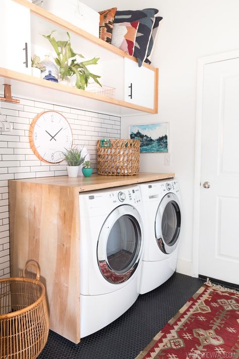 Budget Laundry Room Makeover Reveal!  Love the white subway tile and black penny tile floors!! Wood Laundry Shelf, Laundry Room With High Washer And Dryer, Laundry Room Shelf With Hooks, Wood Top Washer And Dryer, Wood On Top Of Washer And Dryer, Shelf On Top Of Washer And Dryer, Shelf On Washer And Dryer, Front Loader Laundry Room Ideas Counter Tops, Counter On Top Of Washer And Dryer