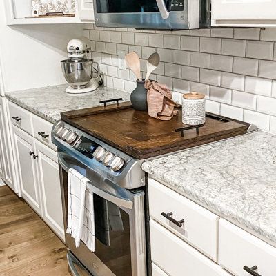 Imagine adding 30 inches of extra counter space to your kitchen. Handmade noodle boards are the perfect way to make better use of your stovetop. Although not food grade, these wooden stove covers are definitely decor-grade. Use a kitchen stove cover to upgrade the look of your stovetop by hiding the unsightly burners and decorating with your favorite spices and kitchen decor. This farmhouse inspired wooden burner cover has been stained in a warm brown to highlight both the natural wood grain and Wooden Stove Top Cover, Wood Burner Stove, Wooden Stove Top Covers, Stove Covers, Wooden Stove, Noodle Boards, Stove Burner Covers, Cook Top Stove, Kitchen Handmade