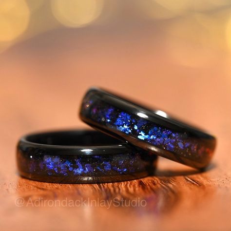 This 6mm Orion Nebula Ring, or outer space ring design is inspired by chasing fireflies, looking up at the night sky and sharing close moments with the people who matter most. This color shifting galaxy ring design is a great choice for anyone searching for a unique promise ring, engagement ring or wedding ring. Your band is made using quality hand selected crushed blue sandstone for a subtle but eye catching shimmering galaxy or nebula effect. The durable, scratch resistant black Tungsten Carbide band gives a solid feel and the black band color gives a nice color contrast with the inlay.  ✔️ 6mm Comfort Fit Band ✔️ Waterproof and safe for swimming ✔️ Solid Feeling Band ✔️ High Scratch Resistance ✔️ Standard Ring Box Included ✔️ Engravings available (instructions in photos) ➤ Please note; Galaxy Wedding Ring, Nebula Ring, Space Ring, Couple Ring Design, Space Rings, Unique Promise Rings, Galaxy Ring, Chasing Fireflies, Wood Ring Box