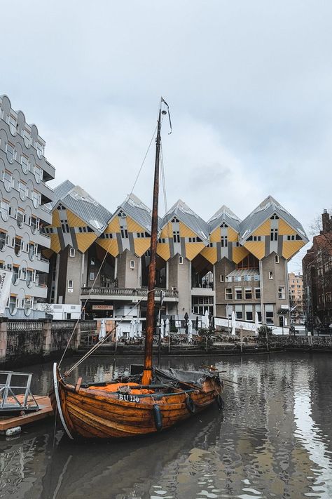 The yellow Rotterdam Cube Houses, with a bay of water and an old wooden boat in the foreground. Rotterdam, Rotterdam Netherlands, Amsterdam Holland, Europe Aesthetic, Explore Italy, Netherlands Travel, The Perfect Day, Visit Italy, South America Travel