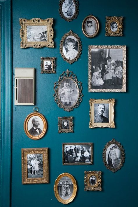 vintage frames with vignettes Wall Of Frames Vintage, Entry Wall Photo Wall, Wall With Vintage Frames, Ancestors Photos Wall, Green Wall With Gold Frames, Gold Frames On Green Wall, Photo Frame On The Wall, Vintage Frame Painting, Wall Of Gold Frames