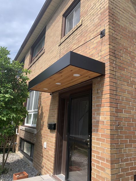 Modern Awning Front Door Exterior, Modern Metal Awning, Modern Front Door Awning, Black Metal Awnings On House, Front Door Canopy Modern, Door Awnings Exterior, Modern Awnings, Awning Front Door, Entrance Awning