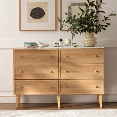 Upgrade your storage space and add a touch of elegance to your bedroom with our 6 Drawer Dresser. Its clean lines and neutral tones bring traditional style and natural warmth to any room. The quick and easy assembly process, sturdy engineered wood construction, and metal glides with safety stops make it a durable and practical choice for your busy lifestyle. Complete with sleek gold handles, this dresser is the perfect solution for all your storage needs. Color: Oak | Winston Porter Sivan 6 - Dr 60in Dresser, Scandanavian Dresser, Cottage Bedroom Furniture, Does Bedroom Furniture Have To Match, Minimalist Bedroom Wood Furniture, Scandi Dresser, Natural Wood Dresser Nursery, Ikea Bedroom Dresser, Grey And Wood Bedroom