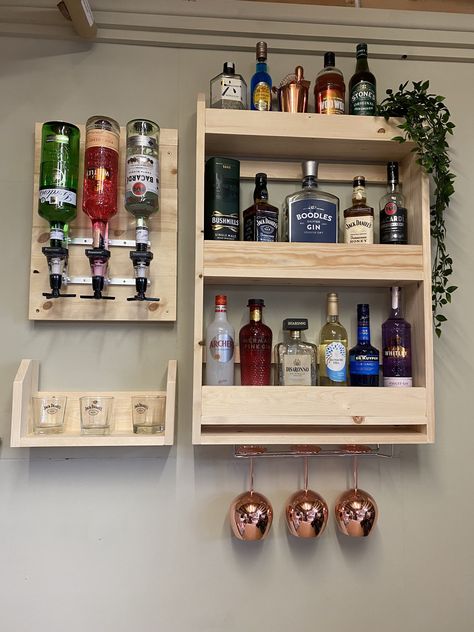 Handcrafted spirits optics plaque bar with shelves for glasses and additional bottle display Made from solid redwood pine Photo is made up of the following combination Bottle rack 900mm high 600mm long 140mm deep 1 x optic plaque (holds 3 optics) 590mm high 370mm long 40mm deep Shelf 200mm high 370mm long 140mm deep This photo shows the drinks bar in natural pine Available stains Beeswax ,dark oak ,medium oak ,dark jacobean ,antique pine ,light oak ,chestnut ,rosewood ,natural pine finish Design Wall Bar Ideas, Kitchen Counter Coffee Bar, Coffee Bar Decorations, Coffee Bar Inspiration, Coffee Bar Ideas Kitchen, At Home Coffee Bar, Counter Coffee Bar, Coffee Bar At Home, Coffee Bar In Kitchen