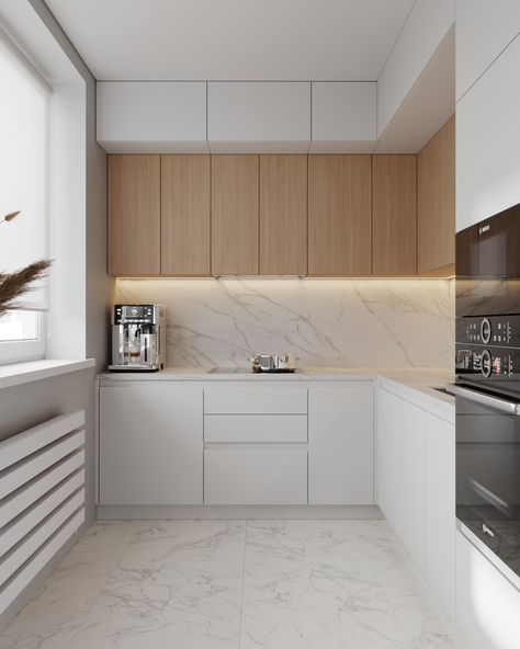 This is a kitchen with white bottom cabinets and light wood top cabinets. The backsplash is made of white marble tile that matches the floor. White Wood Small Kitchen, White And Wood House Interior Design, White Wood Apartment, Cozy Small Living Room Apartment, Kitchen Interior Bright, Soft Modern Kitchen Design, Soft Kitchen Design, Kitchen Interior White And Wood, White And Oak Modern Kitchen