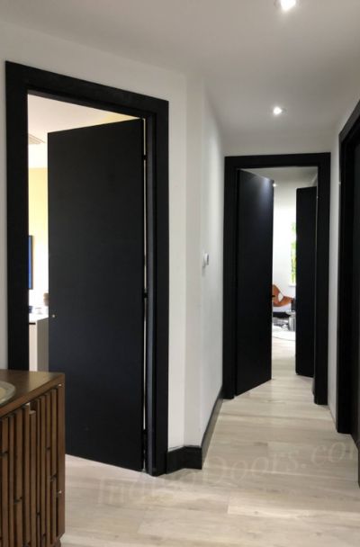 31 Black Interior Trim Ideas - | Sebring Design Build Black Baseboards, Interior Trim Ideas, Black Trim Interior, Black Interior Trim, Black Interior Door, Interior Door Colors, Black Hallway, White Hallway, Modern Hall