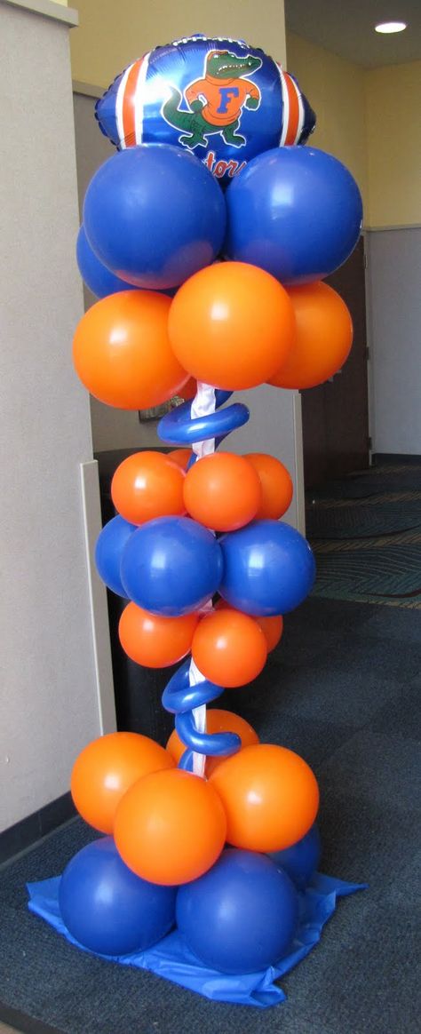 Gator balloon topiary Uf Themed Party, Florida Gators Party Ideas, Gator Graduation Party, Uf Graduation Party Ideas, Gator Party, Uf Gator, Balloon Topiary, Balloon Inspiration, Column Ideas