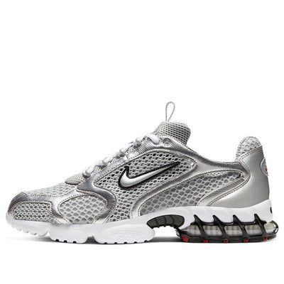 The Nike Air Zoom Spiridon Cage 2 Metallic Silver combines retro flair with futuristic design. Crafted for men, this sneaker features a mesh and synthetic leather upper coated in a sleek metallic silver finish. The raised Swoosh branding on the quarter panel adds a bold touch. Underfoot, a white foam midsole houses a caged Zoom Air unit in the heel for cushioning. The rubber outsole introduces hits of red for a pop of color. Whether you’re hitting the streets or making a style statement, these kicks blend classic aesthetics with modern comfort. The Nike Air Zoom Spiridon Cage 2 Metallic Silver (CJ1288-001) combines retro flair with futuristic design. Crafted for men, this sneaker features a mesh and synthetic leather upper coated in a sleek metallic silver finish. The raised Swoosh brandin Nike Air Zoom Spiridon Cage 2, Nike Vemero5, Chunky Nike Sneakers, Nike Air Zoom Spiridon, Futuristic Design, Air Zoom, Nike Air Zoom, Style Statement, Nike Zoom