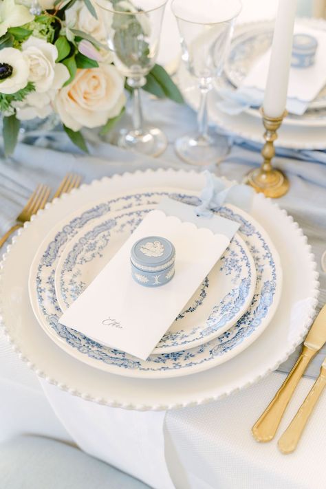 A close up of the blue Wedgwood trinket box fine art wedding favours resting upon the menu at each guest's place setting. | Planner: @bygraceweddings | Photography: @desireeanorth Fine China Table Settings, Wedgwood Blue Wedding, Wedding Table Wear, Dusty Blue Wedding Place Setting, Art Deco Place Setting, Charger Plates Wedding Decor, Blue China Plates Wedding, Blue Place Setting Wedding, Unique Place Settings