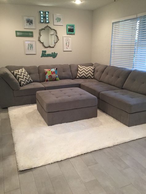 Gray sectional, shag rug, family wall collage Nice Couches Sofas Living Rooms, Nice Sofa Design, Grey Color Sofa Living Room, Ottamon Decor Ideas, Sectional Couch Small Living Room, Gray Sectional Living Room, Grey Sofa Set, Meja Sofa, Sectional Living Room Sets