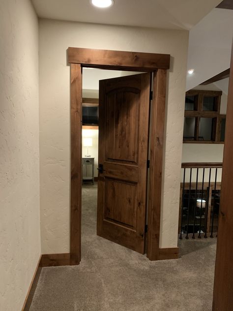 Wood Doors With Wood Trim, Door Trims Ideas, Rustic Door Frame Ideas, Rustic Wood Trim Living Room, Thick Floor Trim, Cabin Interior Doors And Trim, Wood Trim Styles, Rustic Bedroom Door, Trim And Paint Ideas