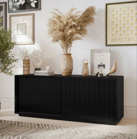 Love this affordable fluted tv stand. You won’t believe the price and 4.6 stars. Run on this deal. It won’t last Fluted tv stand / fluted cabinet/ modern furniture / black cabinet / walmart finds / target / drew Barrymore / toy storage Entertainment center / storage cabinet Follow my shop @blessedhouseofthree on the @shop.LTK app to shop this post and get my exclusive app-only content! #liketkit #LTKhome #LTKstyletip @shop.ltk https://liketk.it/4lQ05 Black Tv Console Living Room, Modern Tv Stand Black, Fluted Tv Stand, Living Room Design Black, Tv Stand Decor Living Room, Stand For Tv, Modern Organic Living Room, Bedroom Tv Stand, Organic Living Room