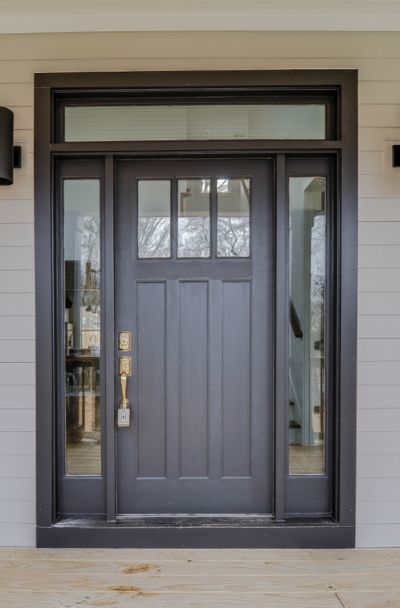 31 Houses With Black Front Entry Door Ideas - | Sebring Design Build Craftsman Exterior Door, Black Entry Doors, Craftsman Front Door, Exterior Doors With Sidelights, Front Door With Sidelights, Black Exterior Doors, Door With Sidelights, Craftsman Front Doors, Entry Door With Sidelights