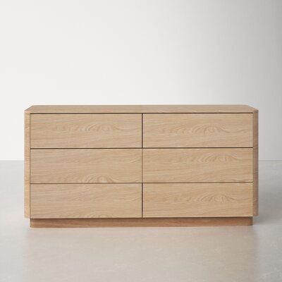 A soft, natural look for your bedroom. The round-off collection is a showcase of organic oak, with the beautiful pale tones of the grain matched to a simple, comforting design. This dresser features a low build and softly rounded corners, with plenty of room for personalized styling across its top. Six drawers glide open to reveal plentiful storage space for your favorite clothing. As part of the round-off bedroom collection, pair it with the nightstand and bed for the complete look. Natural bea Pale Oak Dresser, Scandinavian Dresser Bedroom, Low Dresser Bedroom, Natural Wood Bedroom, Scandinavian Dresser, Light Wood Dresser, Dresser Wood, Wood Dresser, Double Dresser