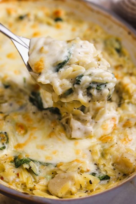 Creamy Spinach And Artichoke Orzo Chicken, Spinach Artichoke Orzo Chicken, Spinach Artichoke Chicken Orzo Bake, Spinach Artichoke Chicken Orzo, Spinach And Artichoke Pasta Bake, Spinach Artichoke Side Dish, Artichoke Orzo Recipes, One Pan Spinach And Artichoke Orzo Bake Half Baked Harvest, Chicken Artichoke Orzo Recipes