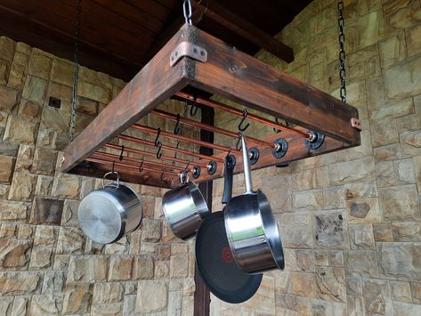 Hang your kitchen pots and pans from the ceiling with this large handmade wooden copper pot hanger. Industrial style. Copper tube 1/2 diameter, board width 4 inches   Anchor securely to the kitchen ceiling with four properly installed heavy duty chains (height optional).       Dimensions: (mm): 1002 W x D x 52 H (inches): 40 inches (W) x 20 inches (D) Kitchen Pots And Pans, Rustic Industrial Kitchen, Pan Hanger, Hanging Pot Rack, Rack Industrial, Robot Lamp, Kitchen Pots, Pallet Kitchen, Hanging Pans