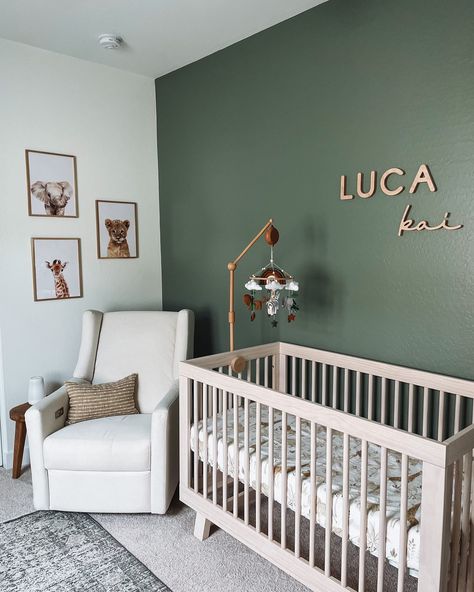 *gasp* it’s gorgeous! I love the way this nursery was styled with our maple name sign to pop on the green walls. And those animal prints are adorable! What is your favourite part of a nursery? #nurserytheme #animaltheme #greennursery #boynursery #namesuggestions #babyboynames #boynames #namesign #nurserysign #nurserynamesign Gender Neutral Nursery Green Accent Wall, Nursery Ideas Unisex Gender Neutral, Forest Green Accent Wall Nursery, Olive Baby Nursery, Basement Nursery Ideas, Rad Boy Nursery, Moss Green Nursery, Dark Green Boy Nursery, Boys Green Nursery